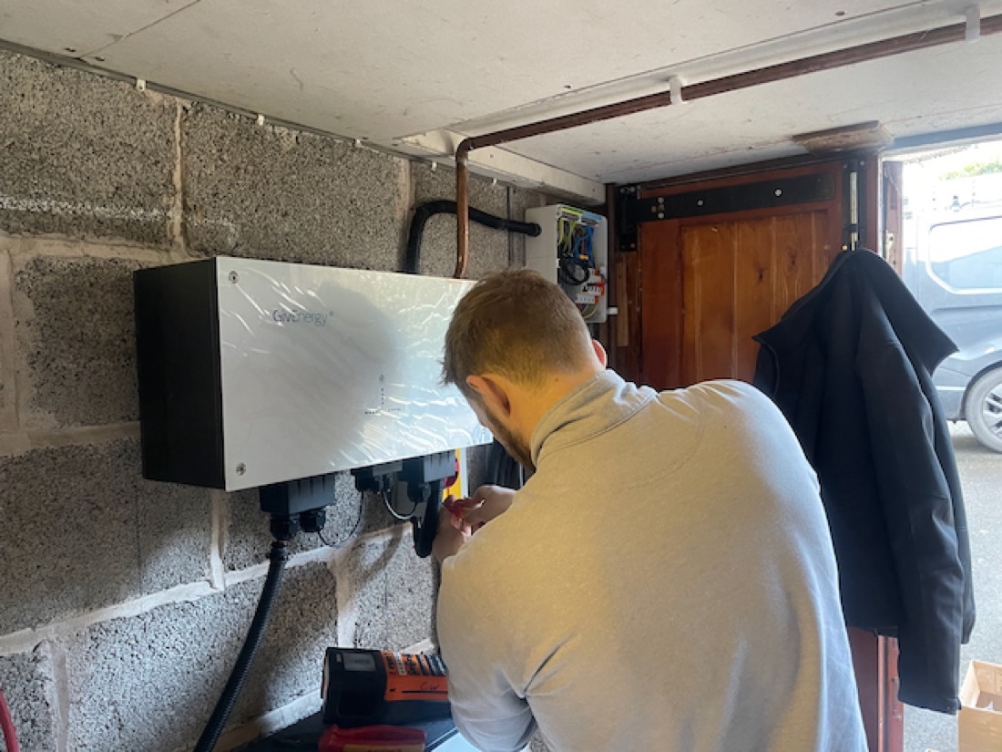 A CW Electrical engineer wiring a battery retrofit in a Bristol garage