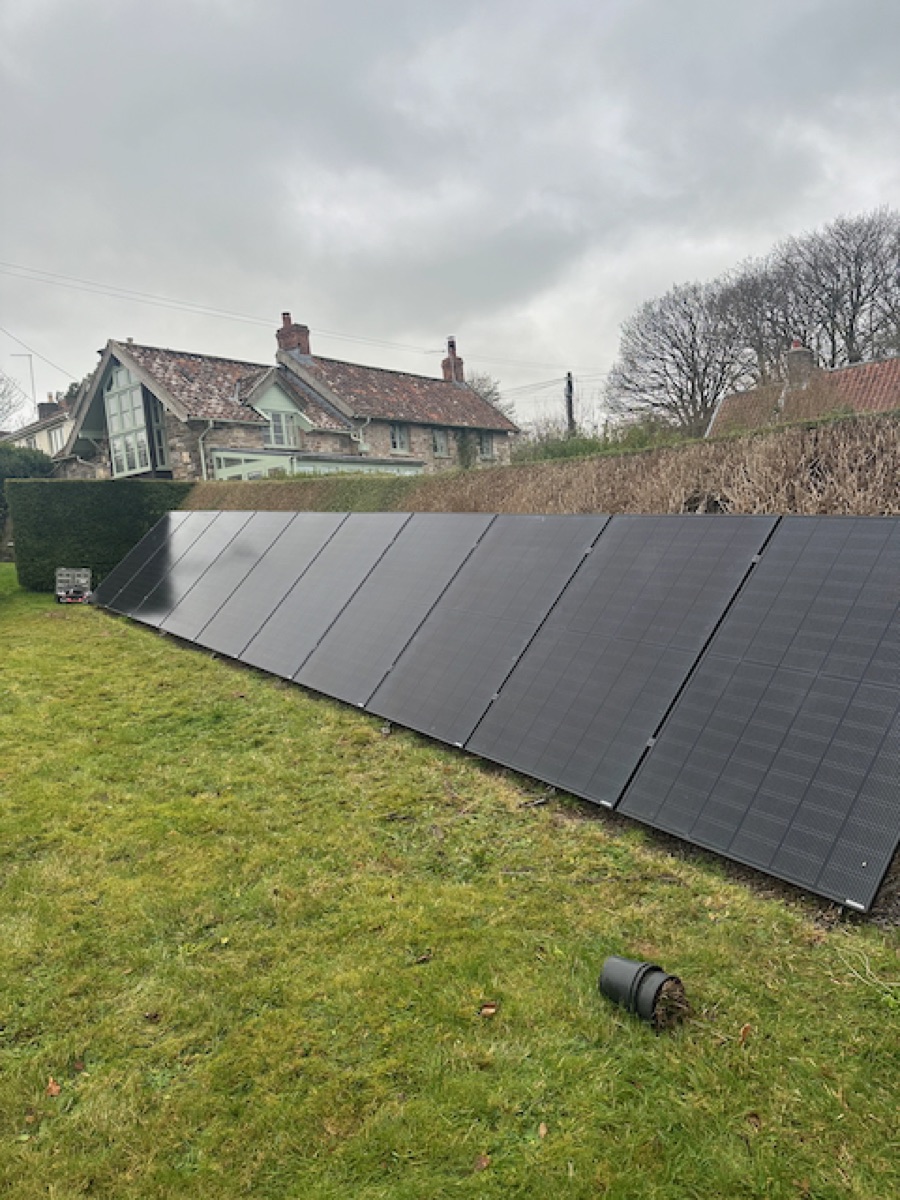 A ground-mounted solar array installed by CW Electrical
